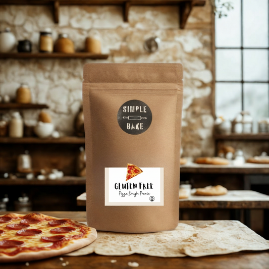 Brown package of gluten-free pizza dough mix with a label on a wooden table in a rustic kitchen setting.