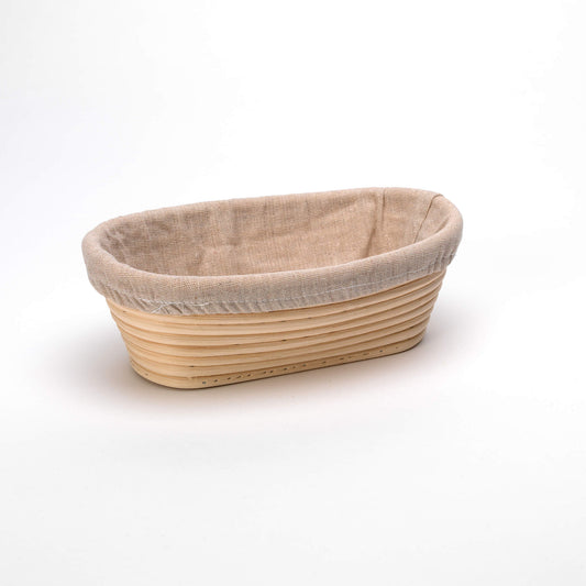 Bread basket with a natural woven design and beige fabric lining on a white background